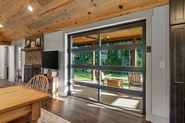 1667 S Old Federal Rd, Chatsworth, GA 30705 - dining area featuring healthy amount of natural light, wood finished floors, a fireplace, lofted ceiling, and wood ceiling