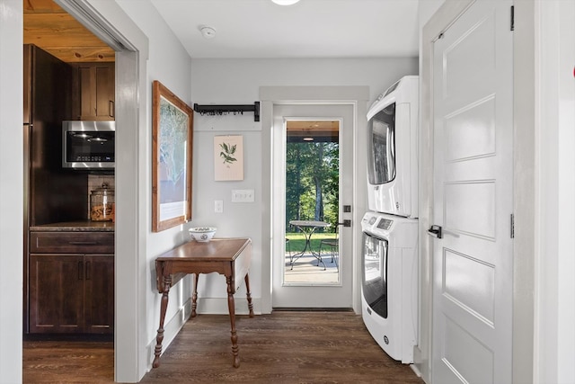 1667 S Old Federal Rd, Chatsworth, GA 30705 - laundry area featuring estacked washer and dryer, dark wood-style floors, and baseboards