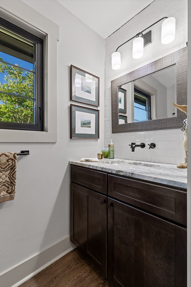 1667 S Old Federal Rd, Chatsworth, GA 30705 - bathroom with vanity, backsplash, wood finished floors, and baseboards
