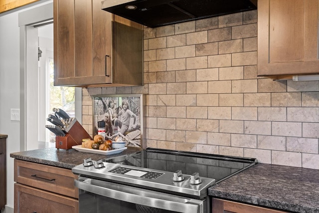 1667 S Old Federal Rd, Chatsworth, GA 30705 - kitchen with range hood, stainless steel electric range oven, decorative backsplash, dark countertops, and brown cabinetry