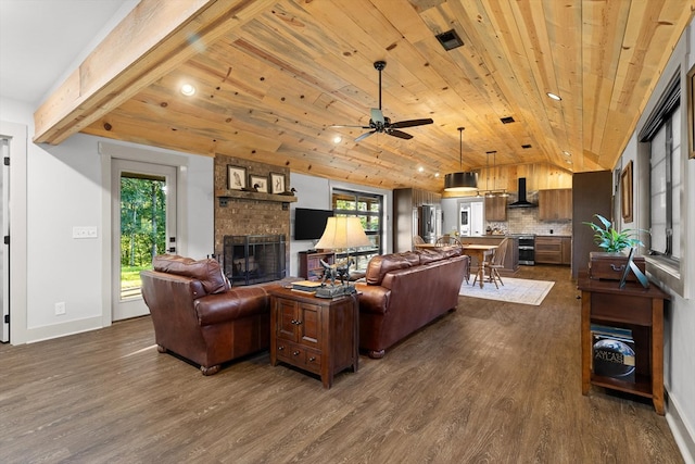 1667 S Old Federal Rd, Chatsworth, GA 30705 - living room with dark wood finished floors, wooden ceiling, vaulted ceiling, a fireplace, and a ceiling fan