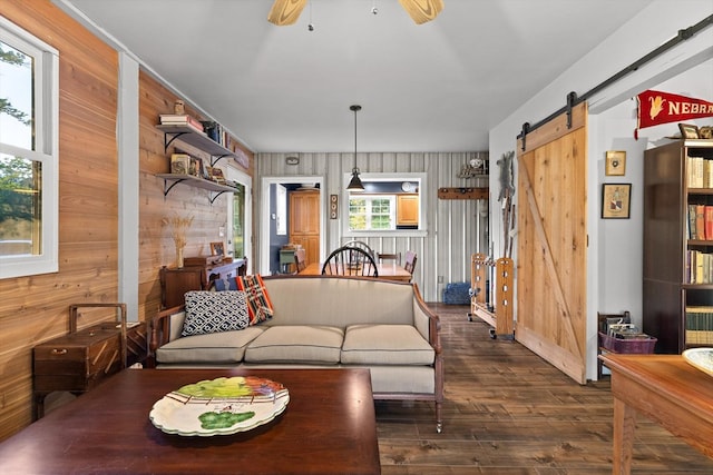 1667 S Old Federal Rd, Chatsworth, GA 30705 - living room with dark wood-style floors, a barn door, wooden walls, and ceiling fan