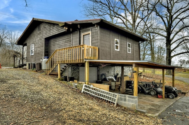 exterior space with a carport and driveway