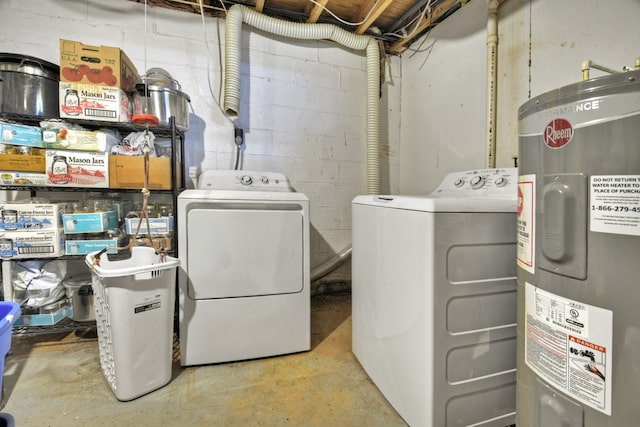 laundry room with water heater, laundry area, and washing machine and clothes dryer