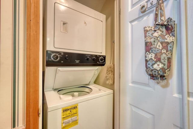 washroom with stacked washer / drying machine