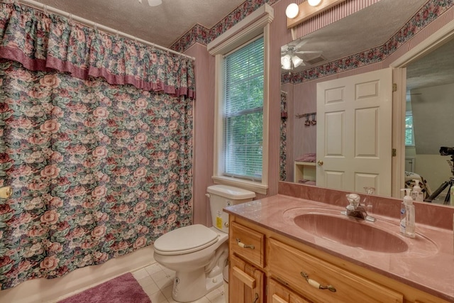 full bathroom with a textured ceiling, ceiling fan, tile patterned flooring, and toilet