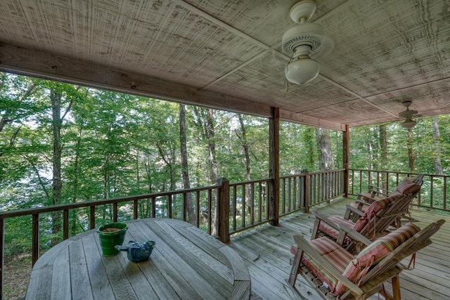 wooden deck featuring ceiling fan