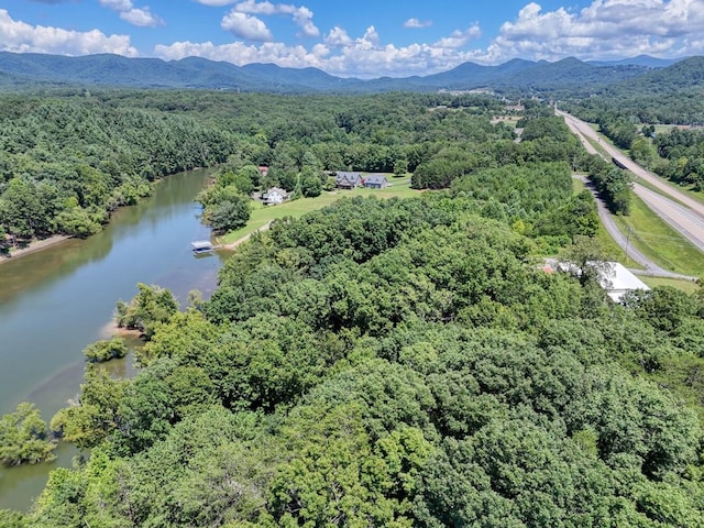 drone / aerial view featuring a water and mountain view