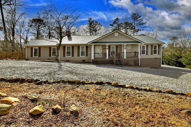 ranch-style house with crawl space, covered porch, and metal roof