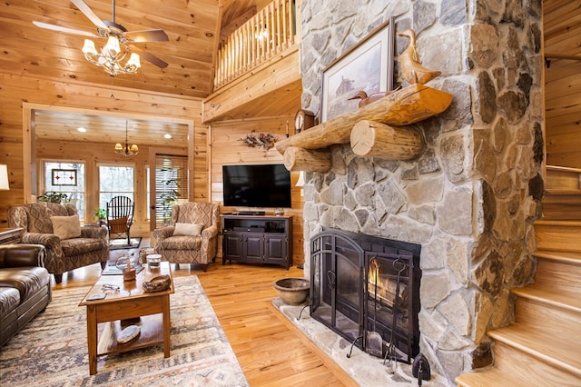 226 Shepherds Walk, Morganton, GA 30560 - living room with light wood-type flooring, wood walls, a stone fireplace, and high vaulted ceiling