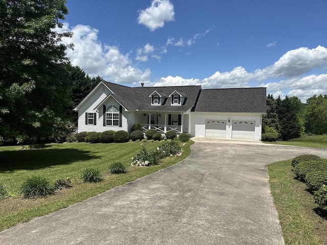 view of front of home featuring a garage and a front lawn