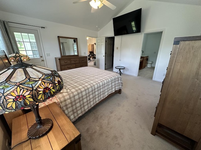 bedroom with light colored carpet, ensuite bath, ceiling fan, and high vaulted ceiling