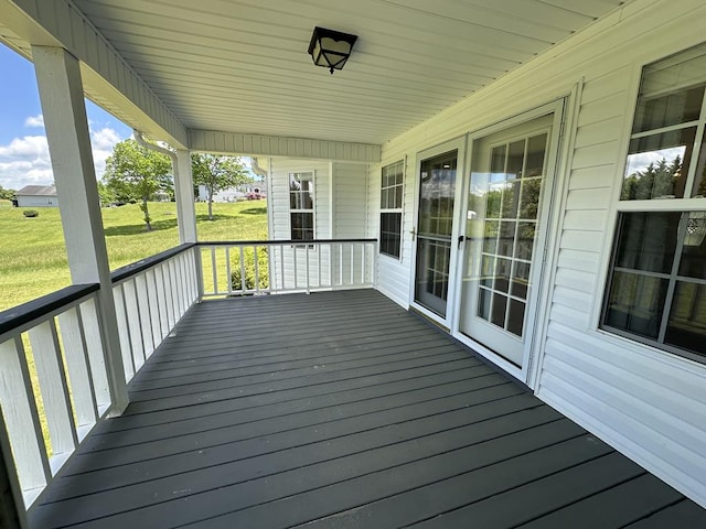 wooden deck with a yard