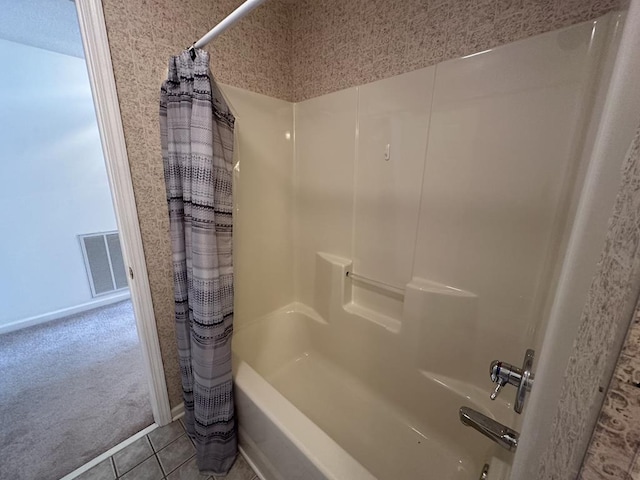 bathroom featuring shower / tub combo and tile patterned floors