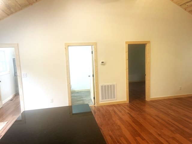 spare room with hardwood / wood-style floors, wood ceiling, and high vaulted ceiling