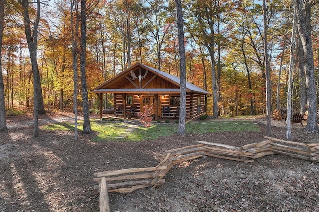 4011 Murphy Hwy, Mineral Bluff, GA 30559 - exterior space with log siding, a wooded view, and an outbuilding