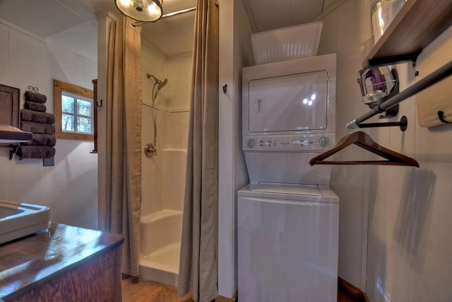 4011 Murphy Hwy, Mineral Bluff, GA 30559 - bathroom featuring stacked washer / drying machine, a shower stall, and wood finished floors