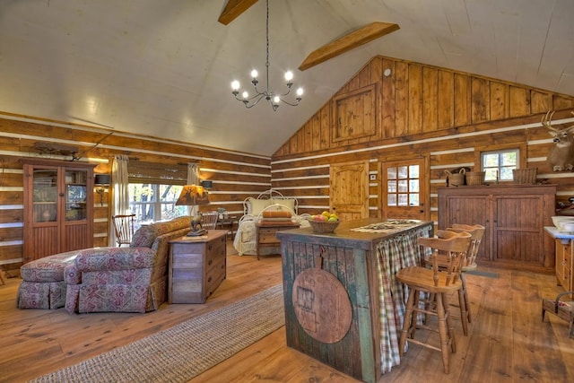 4011 Murphy Hwy, Mineral Bluff, GA 30559 - living area with plenty of natural light, high vaulted ceiling, wood walls, and light wood finished floors