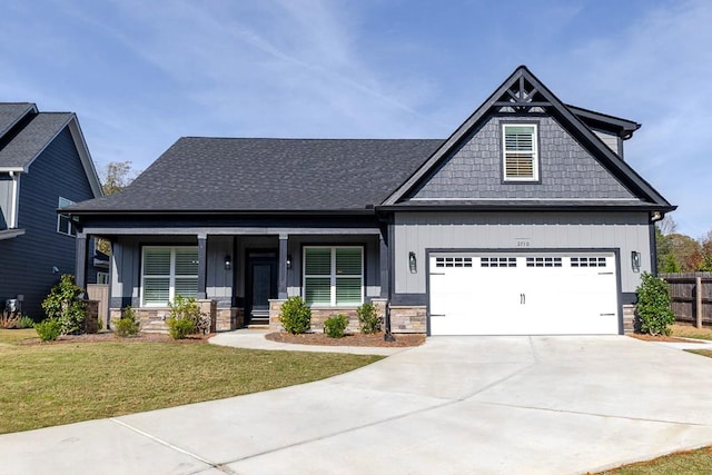 craftsman-style house with covered porch and a front lawn