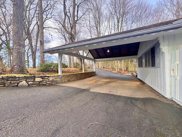 view of vehicle parking with aphalt driveway