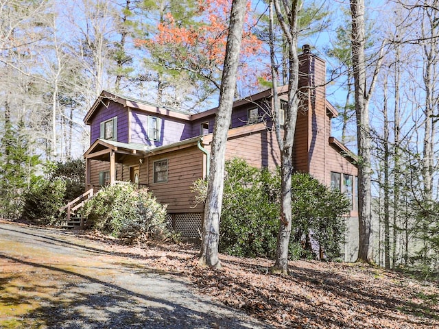 view of home's exterior featuring a chimney