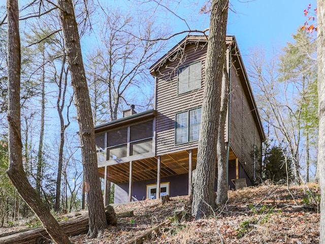 rear view of house with a sunroom