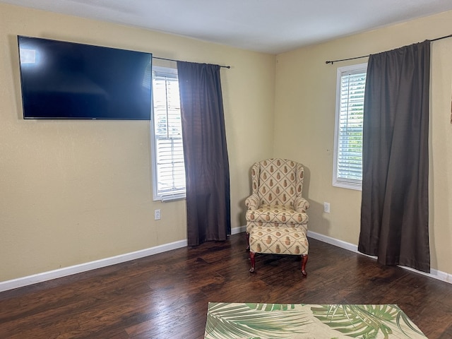 unfurnished room featuring baseboards and wood finished floors