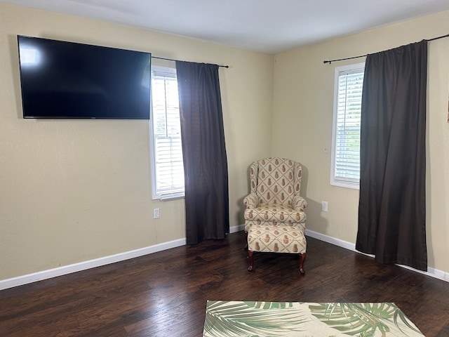 unfurnished room featuring a wealth of natural light, baseboards, and wood finished floors