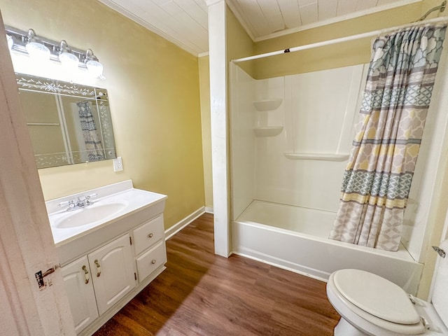 bathroom featuring shower / bathtub combination with curtain, toilet, ornamental molding, vanity, and wood finished floors