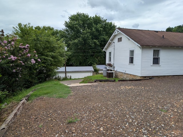 view of yard with central AC unit