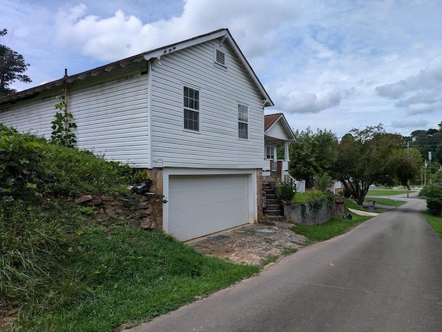 view of home's exterior featuring an attached garage