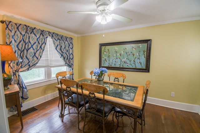 dining space with ornamental molding, visible vents, baseboards, and wood finished floors