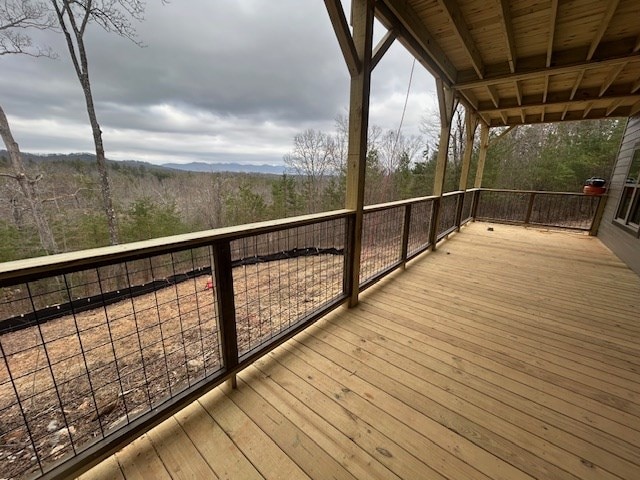 deck featuring a wooded view