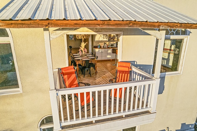 view of patio featuring a balcony