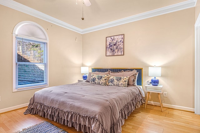 bedroom with ceiling fan, ornamental molding, and light hardwood / wood-style flooring