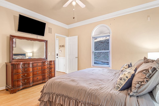 bedroom with crown molding, ceiling fan, and light wood-type flooring