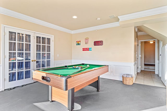 recreation room with french doors, pool table, crown molding, and concrete floors