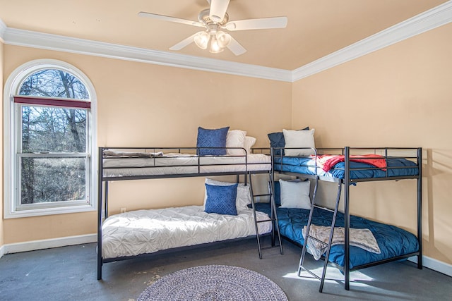 carpeted bedroom featuring crown molding and ceiling fan