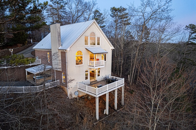 view of home's exterior featuring a balcony