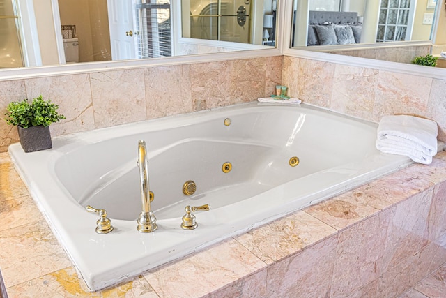 bathroom featuring tiled bath