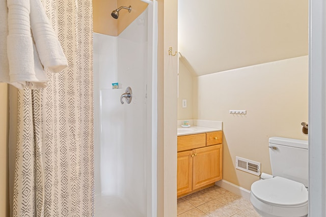 bathroom with lofted ceiling, vanity, a shower with curtain, tile patterned floors, and toilet