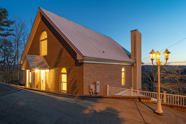 view of property exterior at dusk