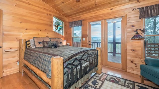 bedroom with access to outside, wood ceiling, vaulted ceiling, hardwood / wood-style flooring, and wooden walls