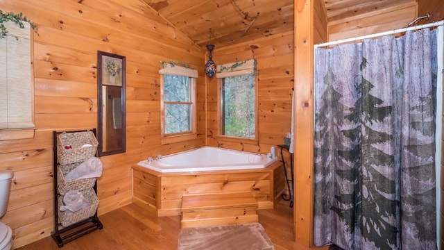 bathroom with lofted ceiling, toilet, wood ceiling, hardwood / wood-style floors, and independent shower and bath