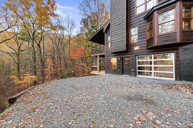 view of side of home with a balcony