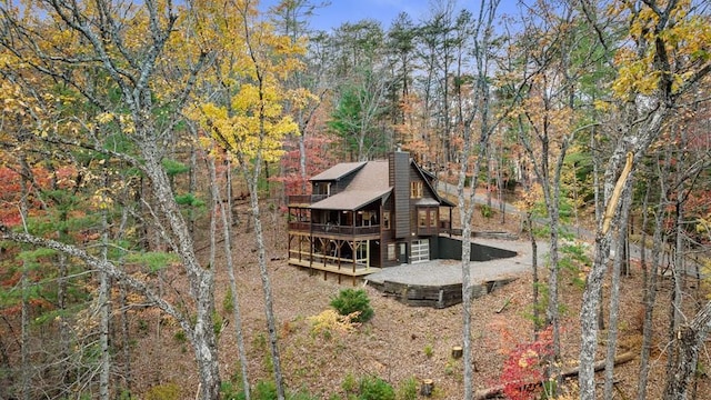 rear view of house with a wooden deck