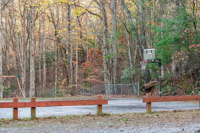 exterior space featuring basketball hoop