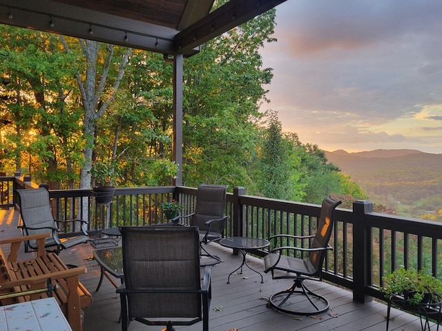 deck at dusk with a mountain view