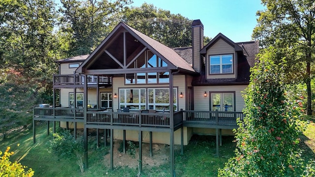 back of house with a wooden deck