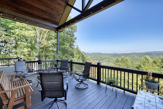 wooden deck featuring a mountain view